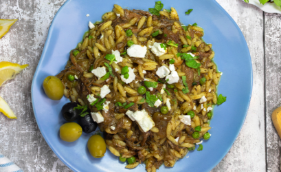 Plate of Greek Pulled Lamb Orzo made using Slow and Steamy Tagine Gourmet Sauce Mix with Feta cheese and Fresh mint to garnish